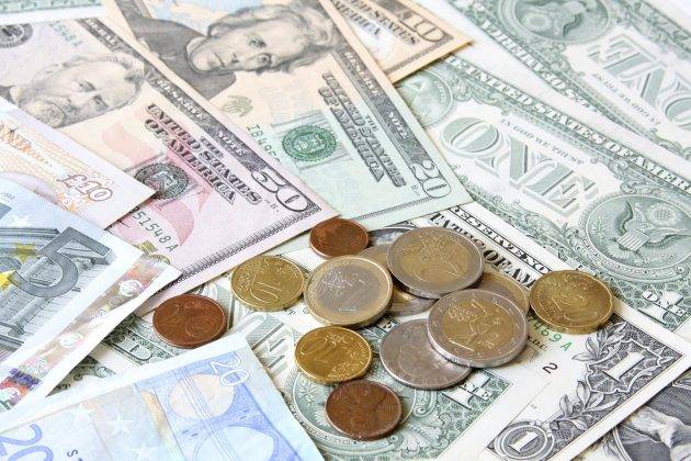 Money. World currencies: U.S. dollars, pounds and euros.