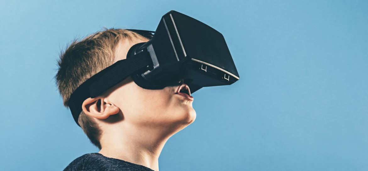 Boy is surprised by content on VR glasses