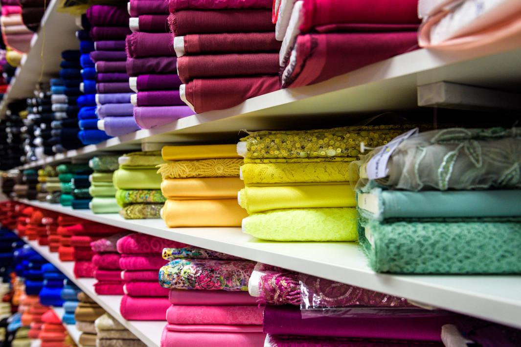 Rolls of fabric and textiles in a factory shop store