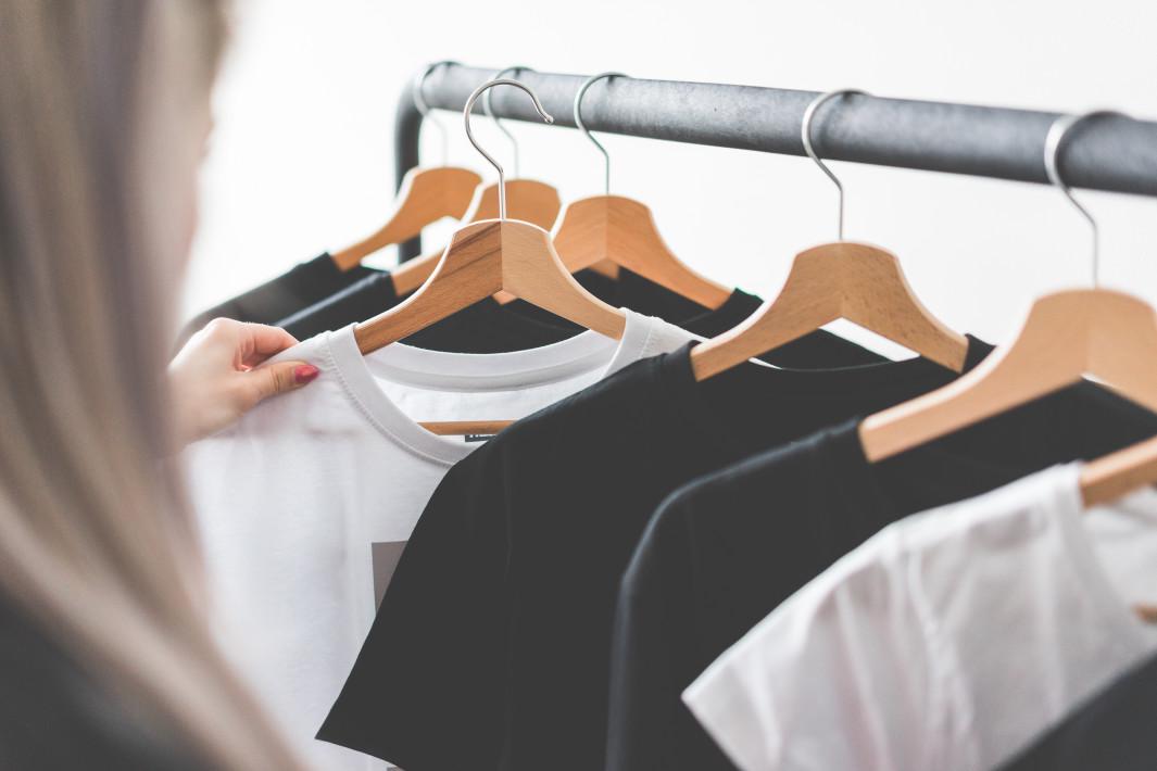 woman-choosing-t-shirts-during-clothing-shopping-at-apparel-store-picjumbo-com